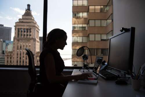 photo of woman at a computer for Gasparian Spivey Immigration