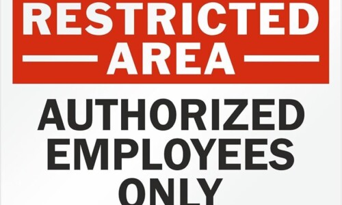 image of a sign saying Restricted Area. Authorized Employees Only.